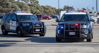Using a roadblock to stop a fleeing suspect is a Fourth Amendment seizure of the person                                