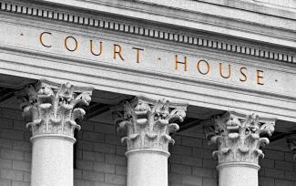 An illegal detention may poison an otherwise lawful search under the “fruit of the poisonous tree